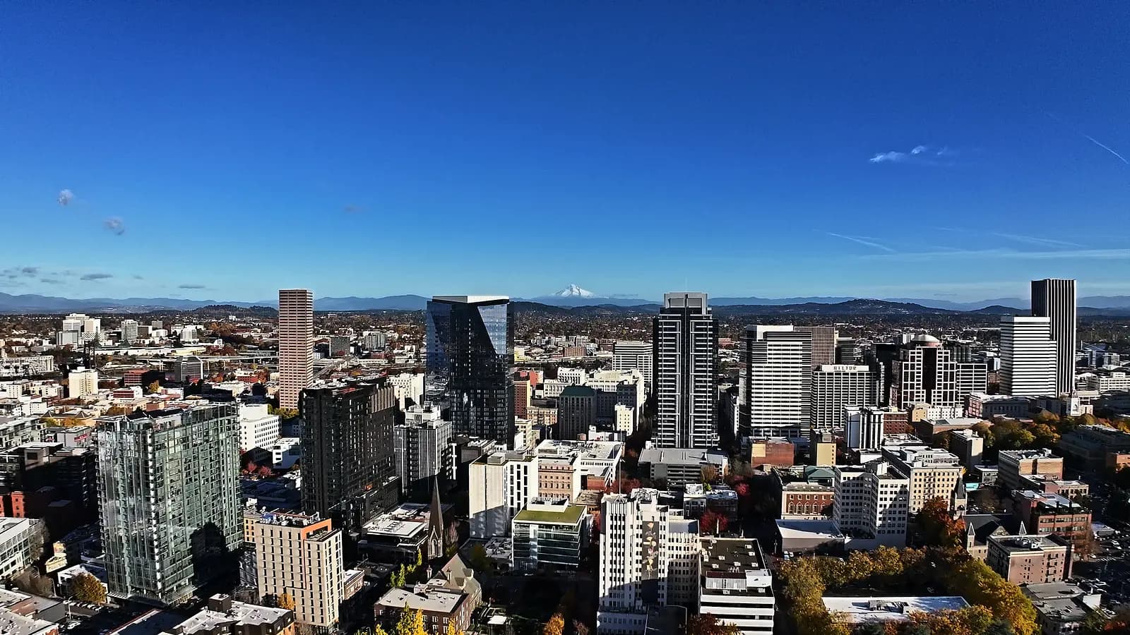 Aerial view of the downtown Portland skyline with the West Hills behind