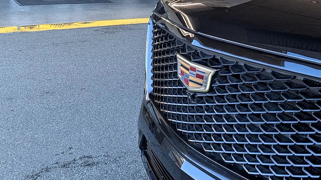 Cadillac Escalade grille and crest detail — the SUV waiting curbside after a PDX meet and greet