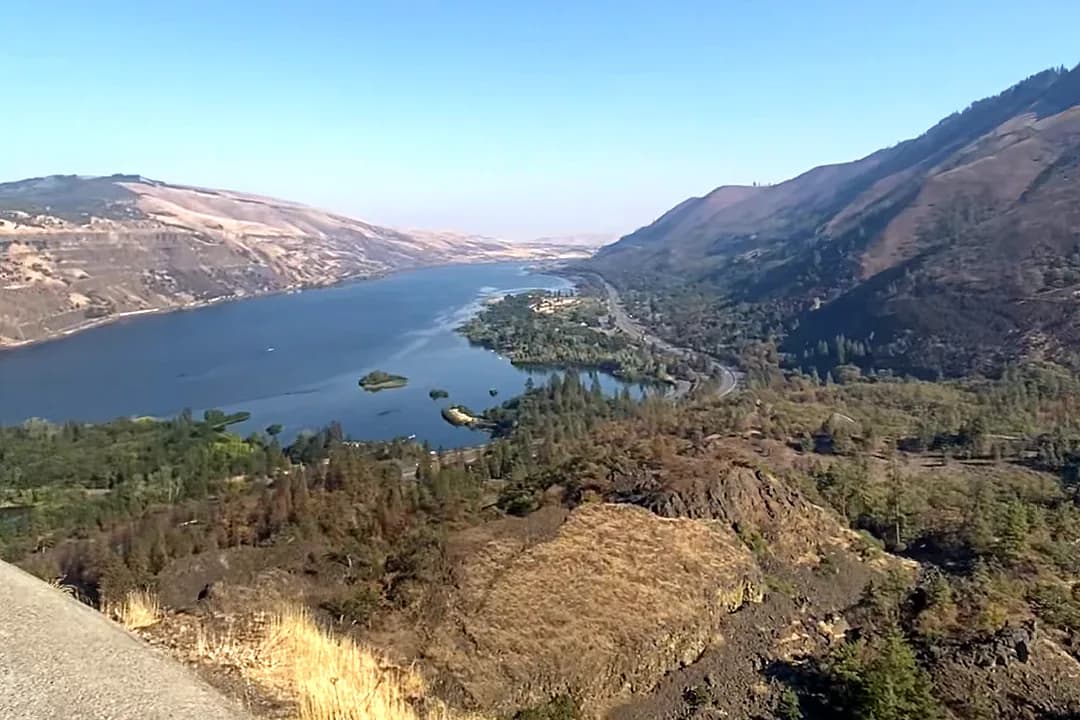 View from a gorge viewpoint over a winding road, ridgelines and the river below — private tour destination